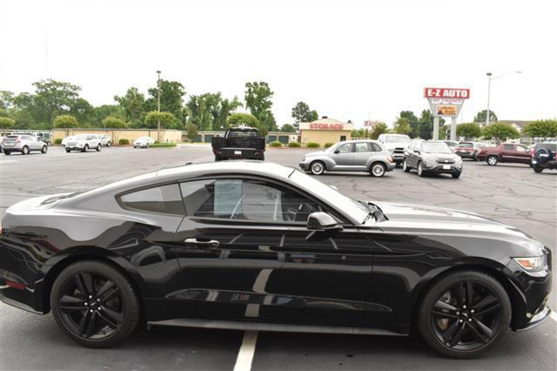 2015 Black Ford Mustang EcoBoost Premium Coupe (1FA6P8TH9F5) , 6-Speed Automatic transmission, located at 3900 Bragg Blvd., Fayetteville, NC, 28303, (910) 868-3000, 35.081905, -78.943367 - T-9527 - 2015 Ford Mustang 1FA6P8TH9F5418581 - Photo #1