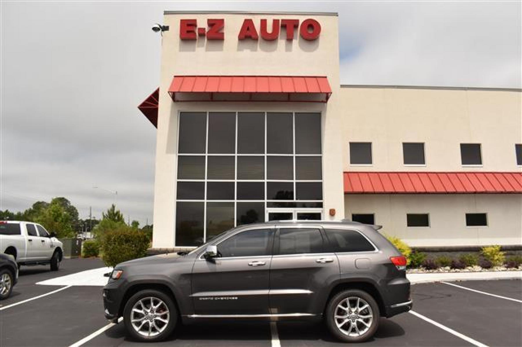 2014 Black Jeep Grand Cherokee Summit 4WD (1C4RJFJG0EC) , 5-Speed Automatic transmission, located at 3900 Bragg Blvd., Fayetteville, NC, 28303, (910) 868-3000, 35.081905, -78.943367 - Photo #0