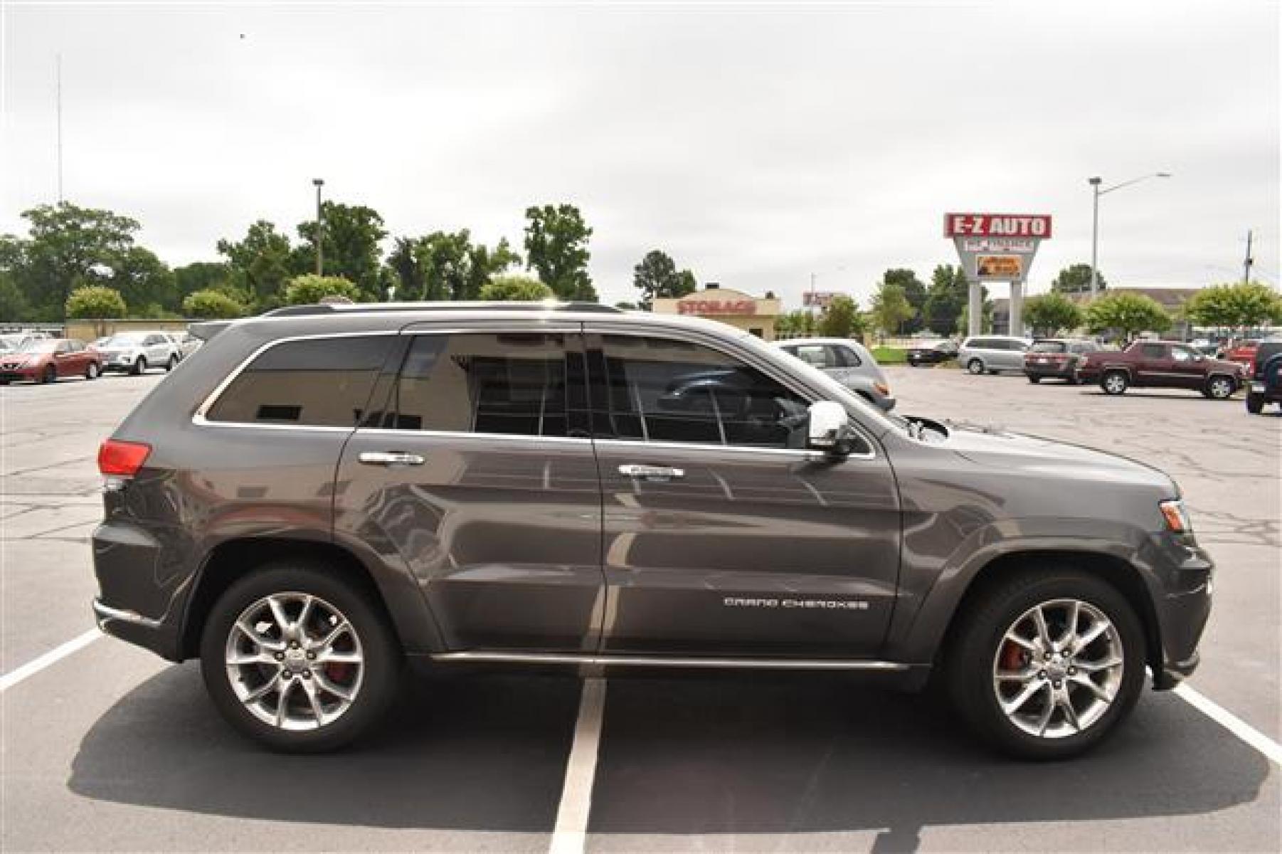 2014 Black Jeep Grand Cherokee Summit 4WD (1C4RJFJG0EC) , 5-Speed Automatic transmission, located at 3900 Bragg Blvd., Fayetteville, NC, 28303, (910) 868-3000, 35.081905, -78.943367 - T-9583 - 2014 Jeep Grand Cherokee 1C4RJFJG0EC214205 - Photo #1