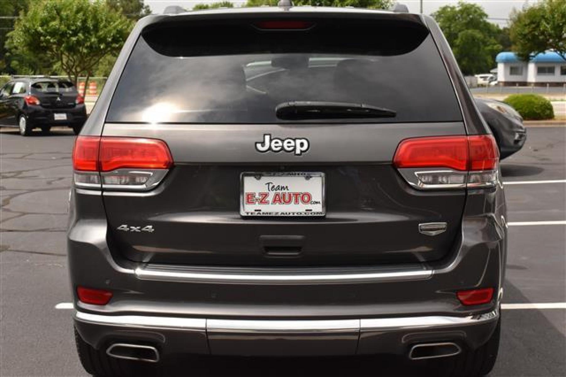 2014 Black Jeep Grand Cherokee Summit 4WD (1C4RJFJG0EC) , 5-Speed Automatic transmission, located at 3900 Bragg Blvd., Fayetteville, NC, 28303, (910) 868-3000, 35.081905, -78.943367 - Photo #3